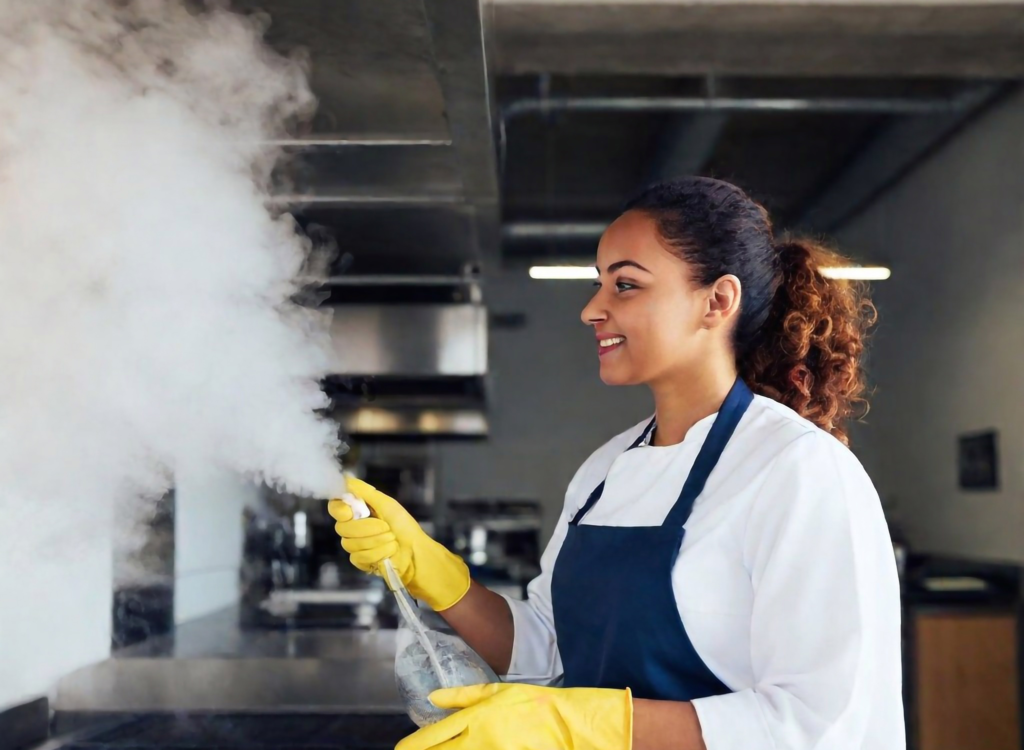 A-professional-cleaner-cleaning-a-hood-duct-in-restaurant